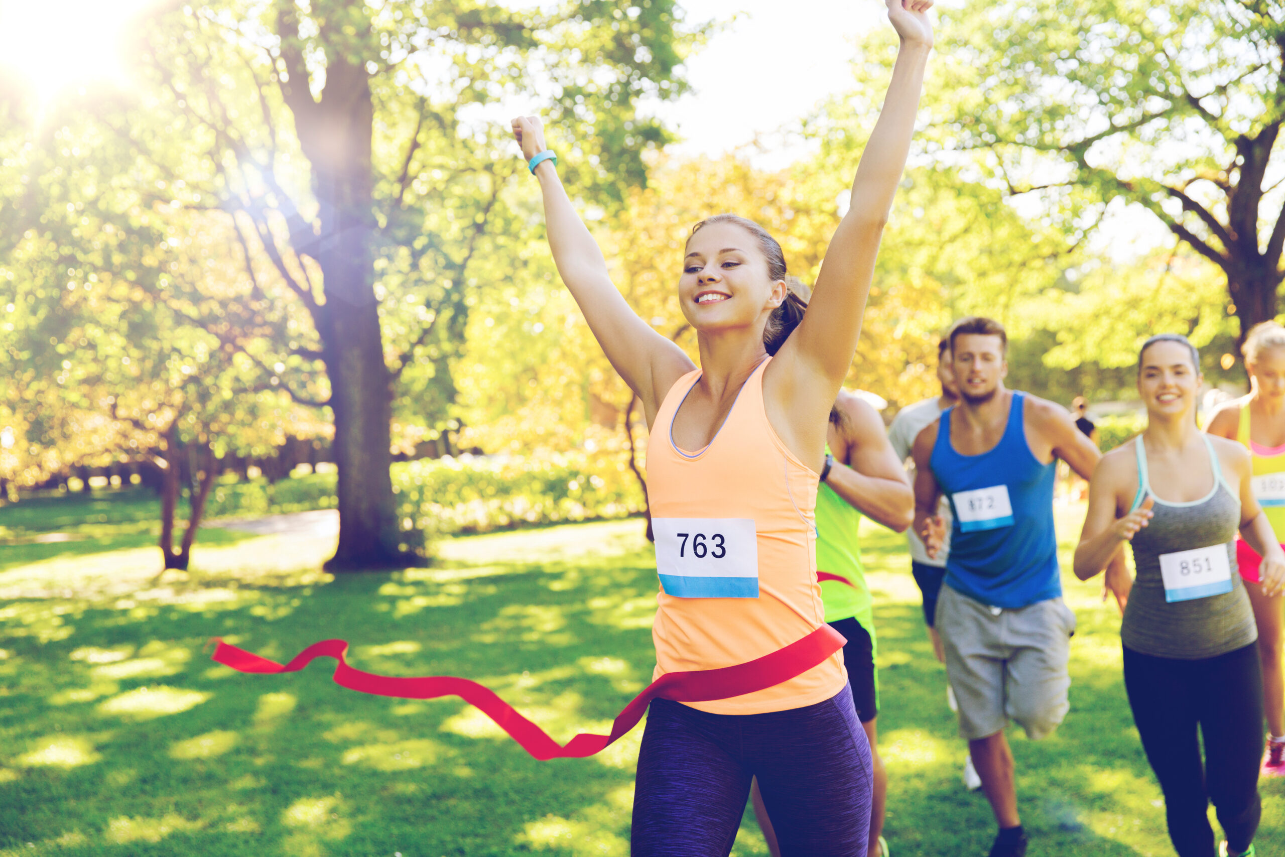 happy young female runner winning on race finish Autoimmune